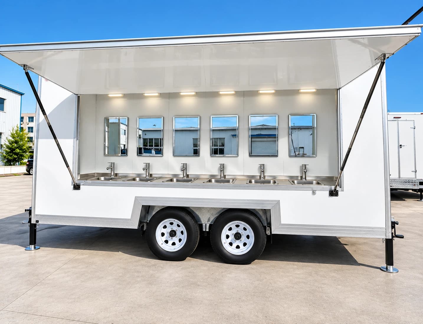 Trailer-mounted handwashing facility with a row of sinks