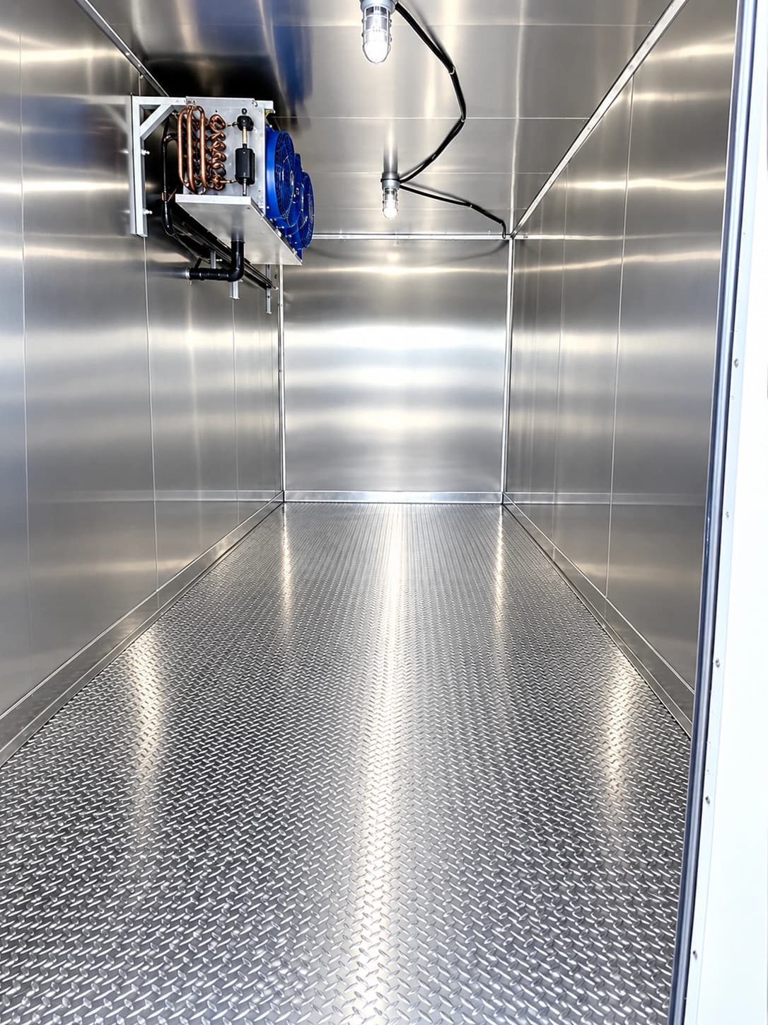 Refrigerated trailer interior with cooling equipment at the far end